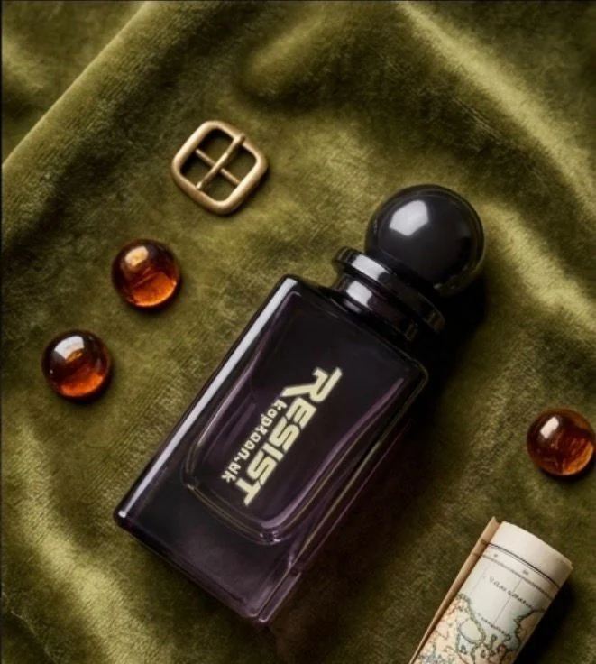 Resist bottle on olive velvet